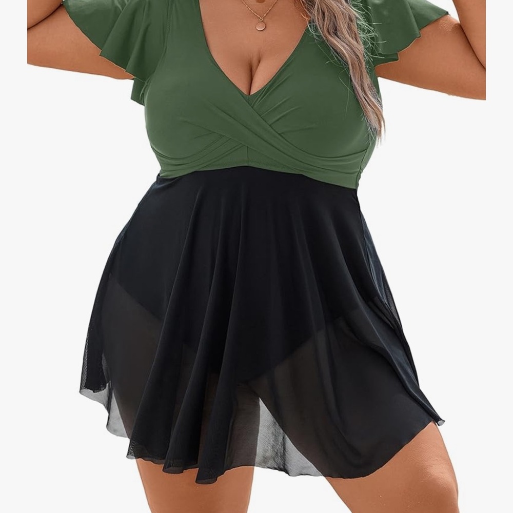 Beautiful swimdress with mesh over the attached panty and tummy control. Size 16